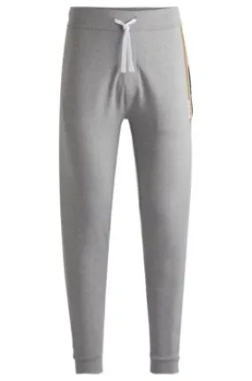 Cotton-terry tracksuit bottoms with stripes and logo